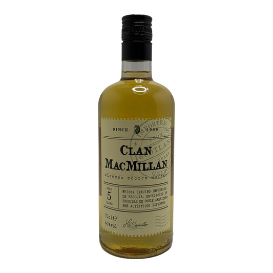 Bottle of Clan MacMillan blended whisky with label visible, showcasing rich amber color and detailed branding.