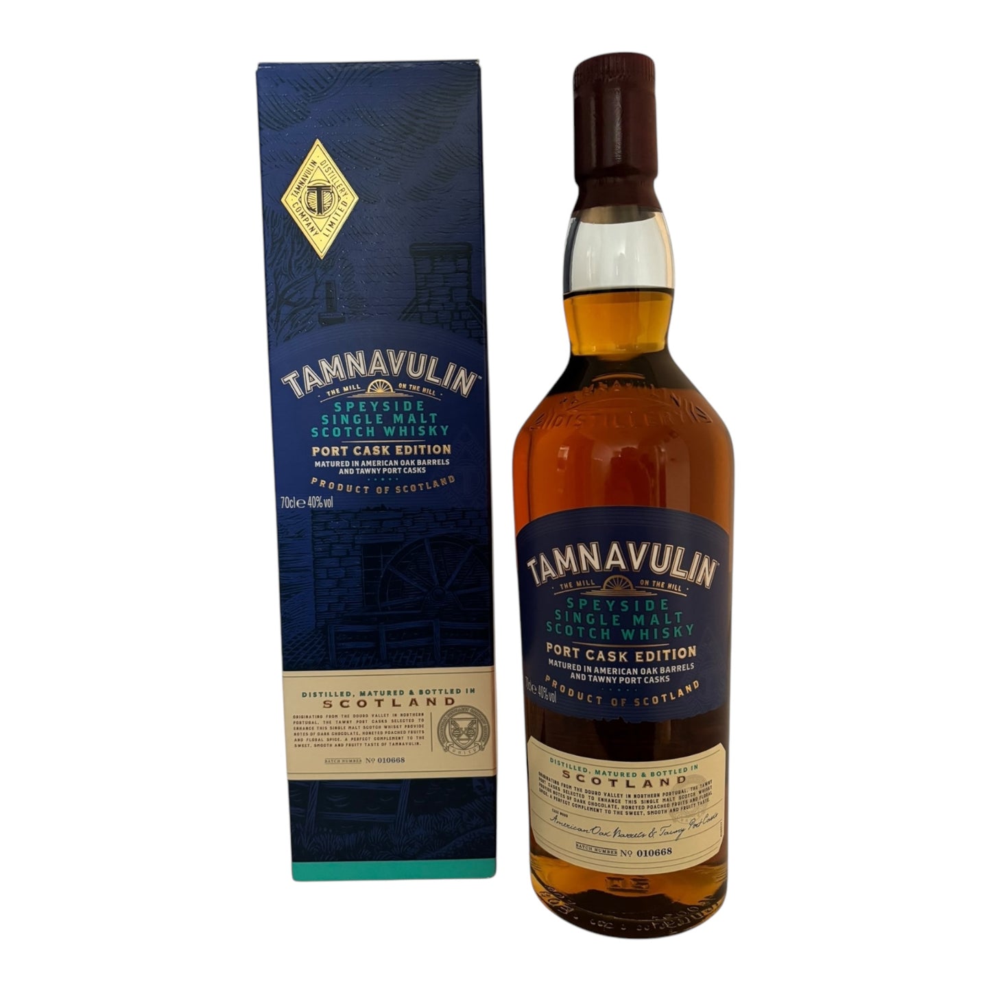 Tamnavulin Port Cask single malt whisky bottle with a dark amber liquid inside on a wooden surface.